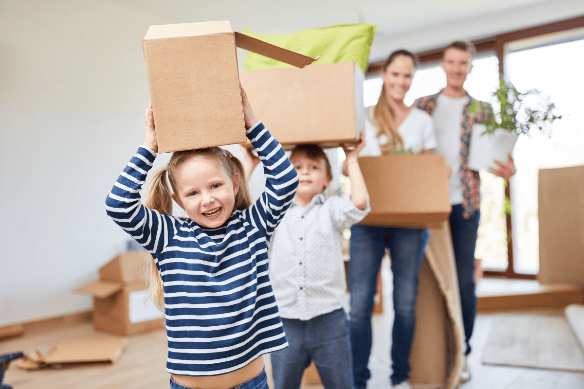 family moving and carrying boxes